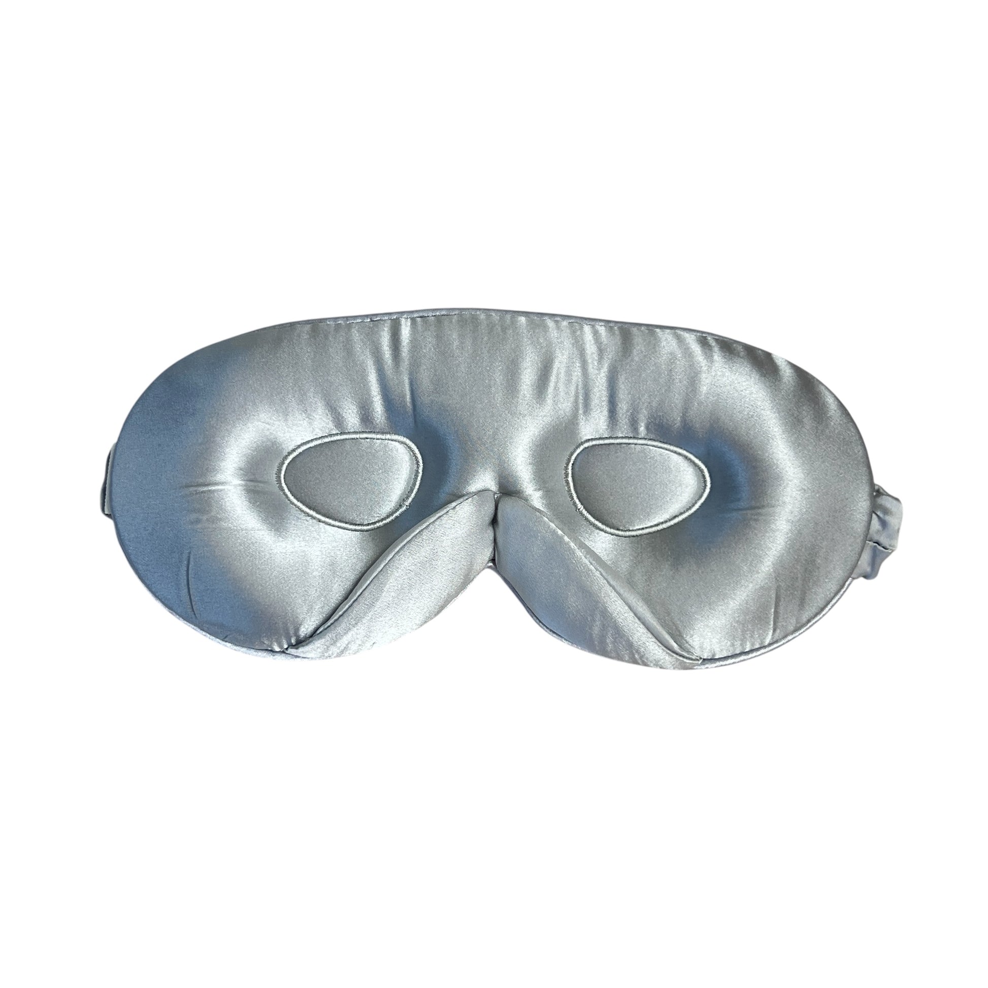 Silver silk 3D eye mask on a white background