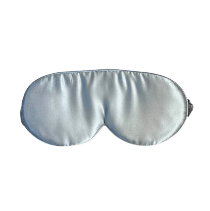 Silver silk sleep mask on a white background
