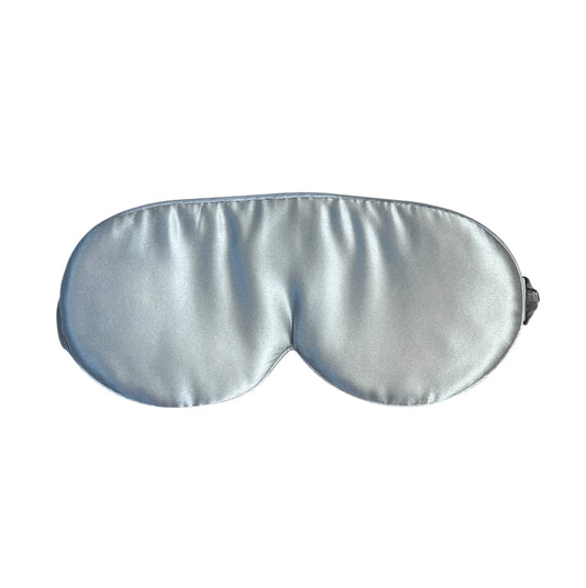 Silver silk sleep mask on a white background