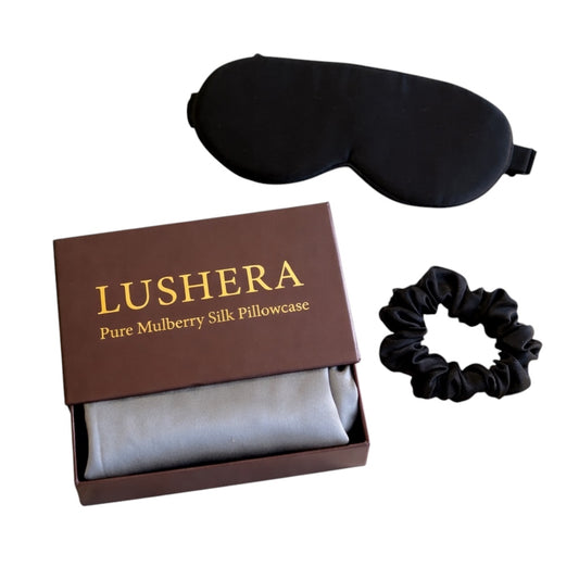 Lushera pure mulberry silk pillowcase set with a black sleep mask and scrunchie on a white background