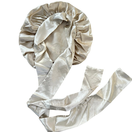 champagne silk hair bonnet on a white background