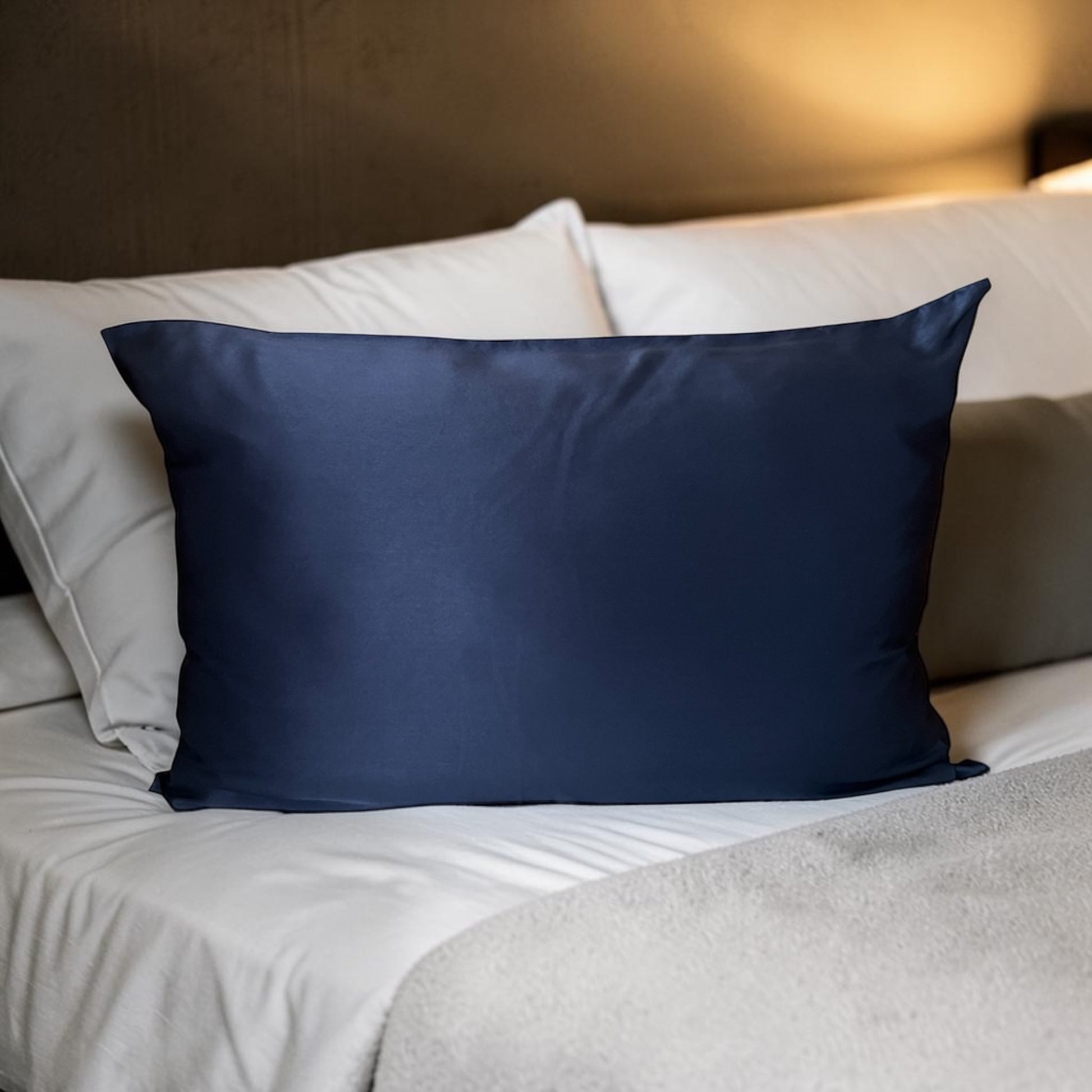 Navy mulberry silk pillowcase on bed