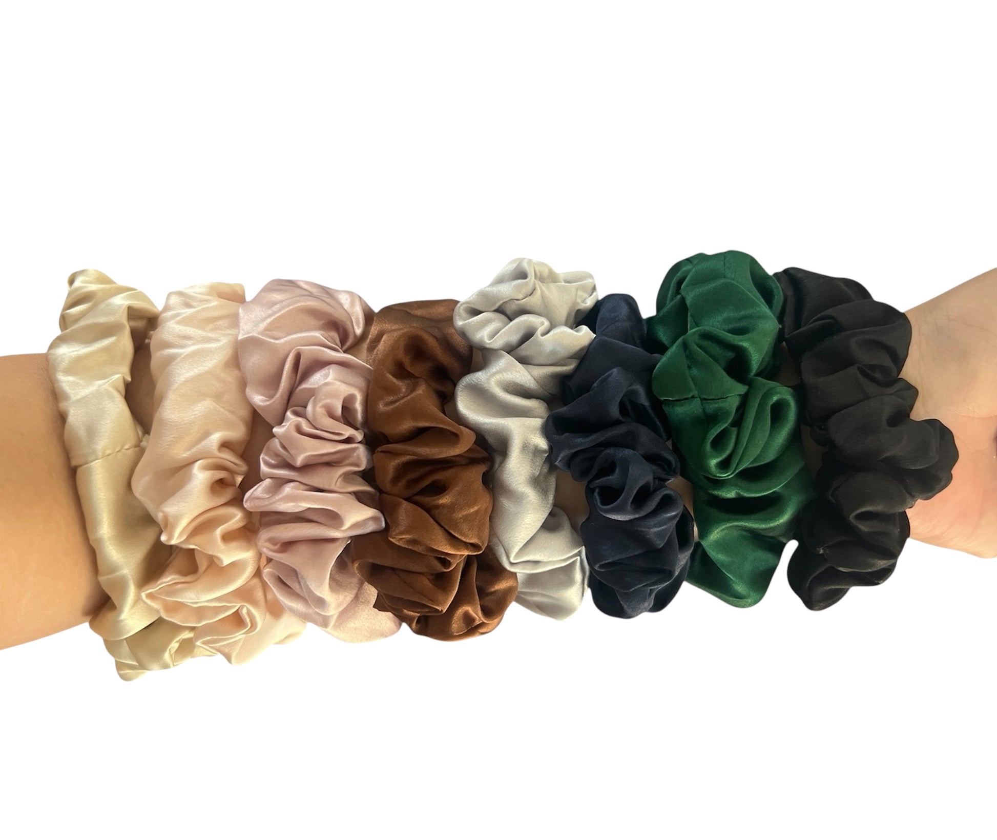 Set of colorful silk scrunchies on a white background