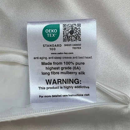OEKO-TEX label on a silk fabric with a humorous warning text.